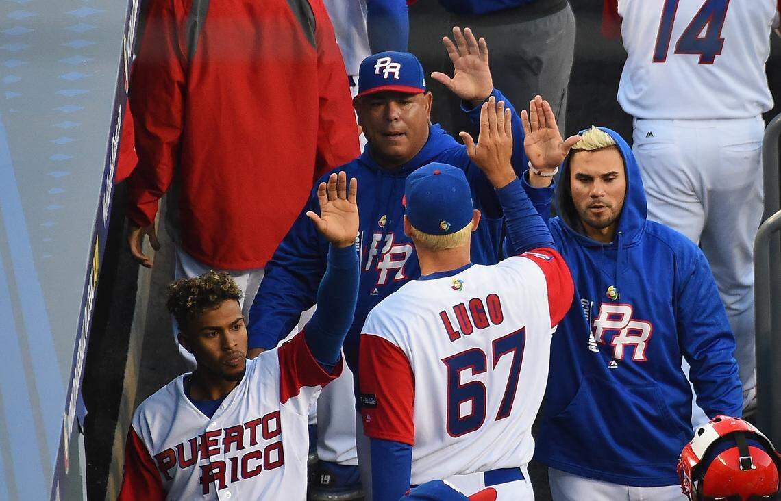 Seth Lugo #67 of team Puerto Rico greeted in the dugout after the first inning against team United States during Game 3 of the Championship Round of the 2017 World Baseball Classic at Dodger Stadium on March 22, 2017 in Los Angeles, California.