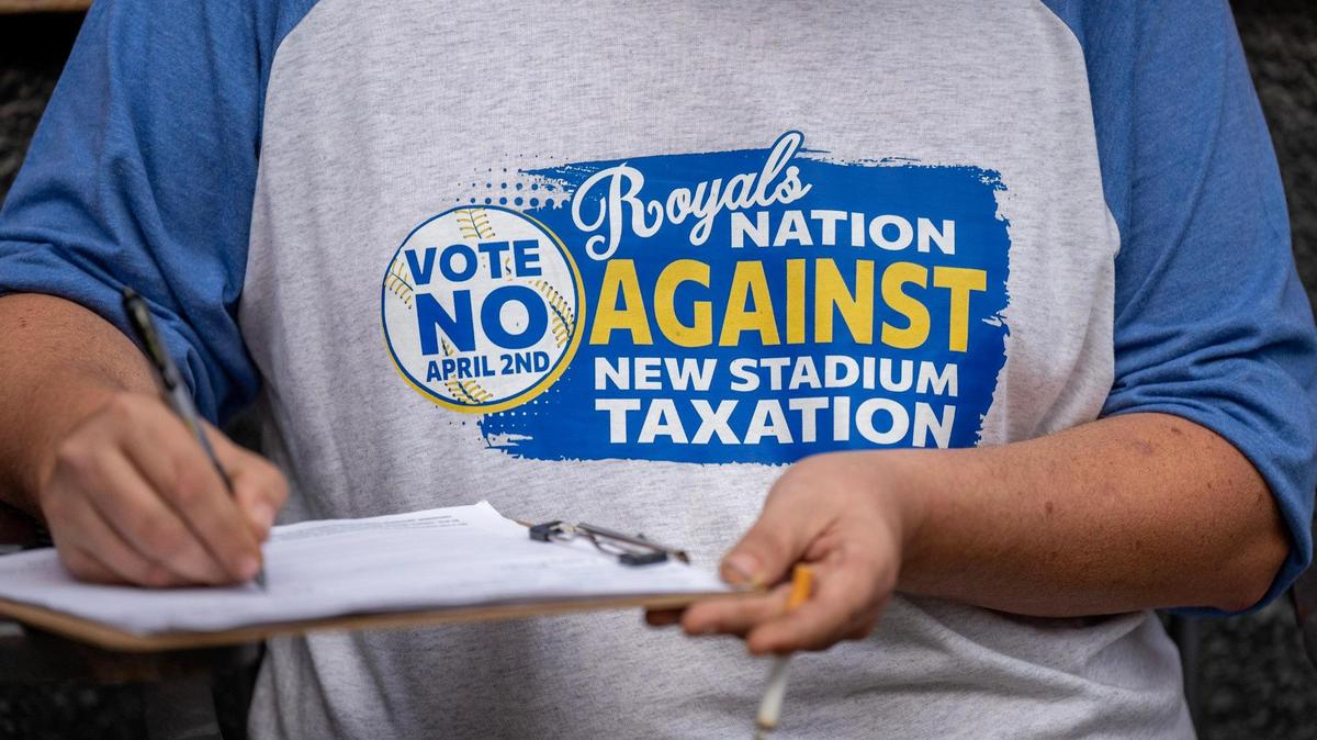 A customer wearing a “Vote No” shirt Monday at The Brick. The election on the stadium tax is April 2.