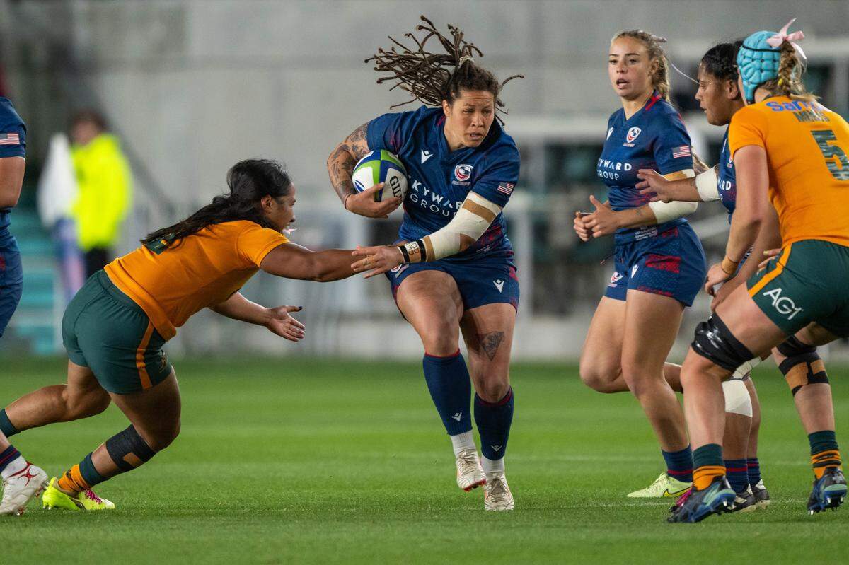 Katana Howard of team USA runs through team Australia players in the first half of the Pacific Four Series rugby match of USA vs. Austrailia on Friday, April 17, 2026, at CPKC Stadium. Team USA won 33-12.