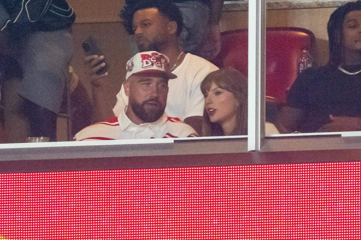 Travis Kelce and Taylor Swift during the third quarter between the Cincinnati Bearcats and the Nebraska Cornhuskers at GEHA Field at Arrowhead Stadium. 
