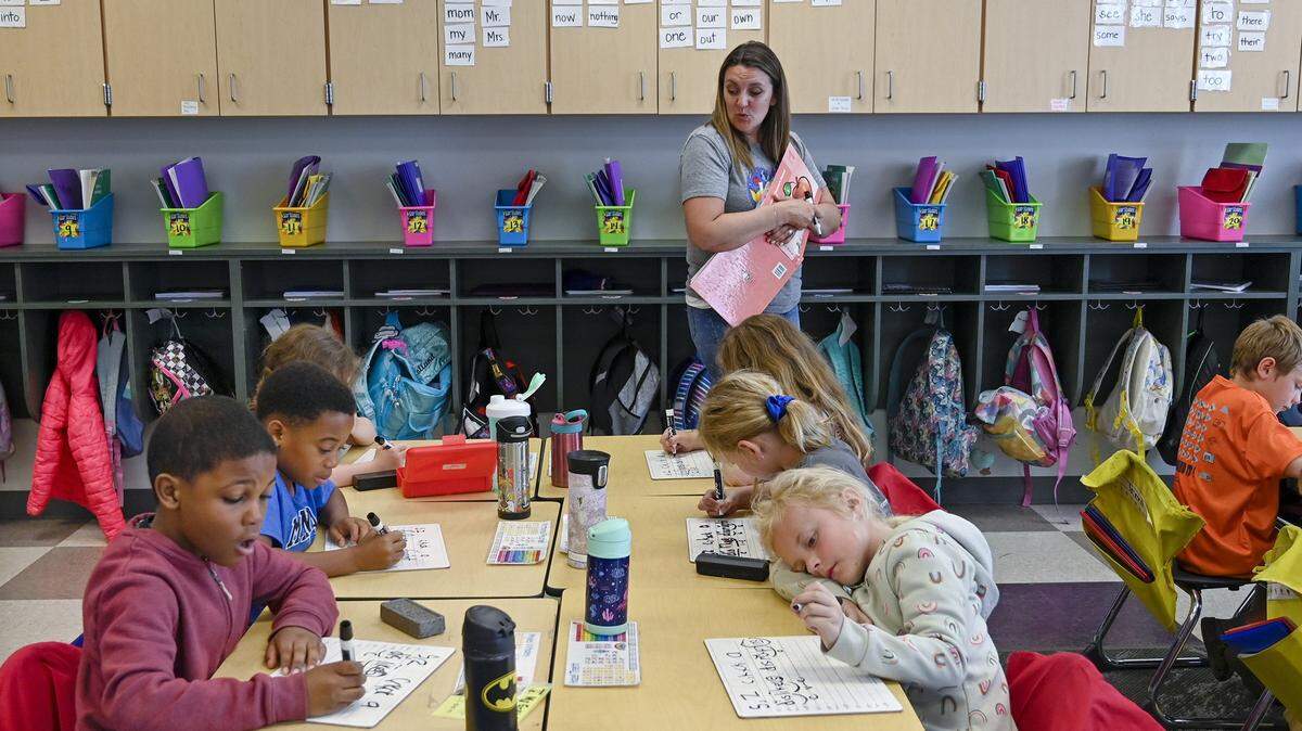 Piper Prairie Elementary School teacher Mary Krejci watches as her first grade students write a sentence on their white boards in this 2023 file photo. The Piper USD 203 school district is choosing its Board of Education in November 2025.