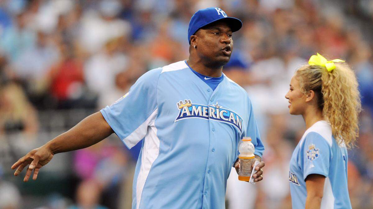 Former Kansas City Royals player Bo Jackson (left) talks with recording artist Haley Reinhart during the 2012 Legends and Celebrity softball game at Kauffman Stadium on July 8, 2012.