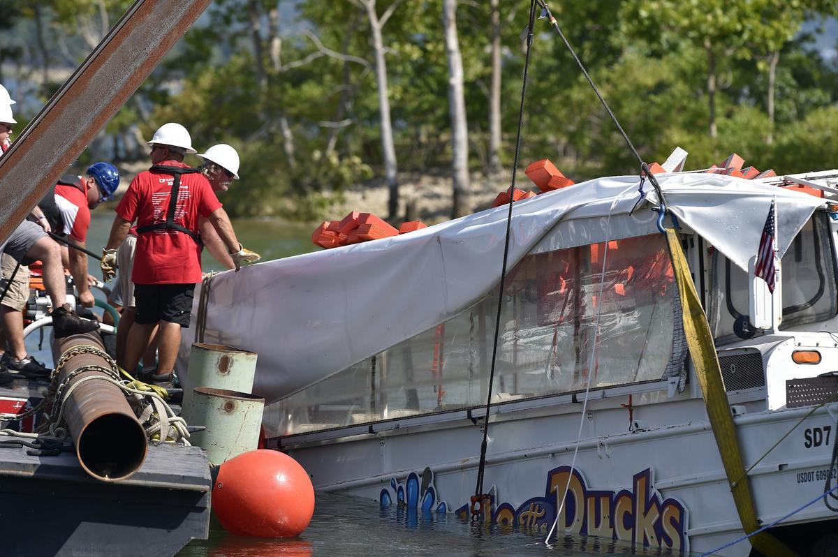 Members of a U.S. Coast Guard crew used a special barge and a crane to retrieve the duck boat that sank in Table Rock Lake on July 19, 2018, during a strong storm. Seventeen people died in the tragedy.