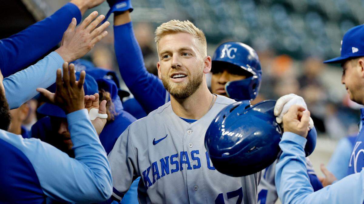 Kansas City Royals first baseman Hunter Dozier (17) is congratulated by teammates after hitting a two-run home run in the second inning against the Detroit Tigers at Comerica Park on Sept. 27, 2022.