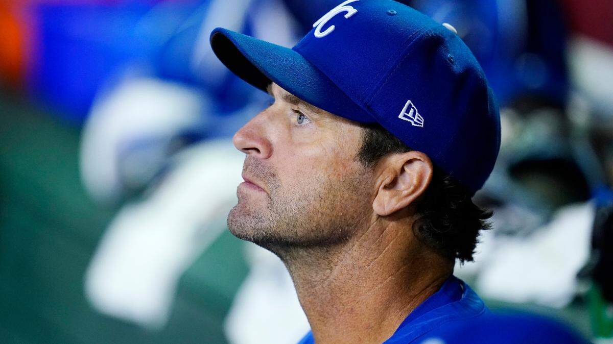 Kansas City Royals manager Mike Matheny watches the action on the field from the dugout during the eighth inning of a baseball game against the Arizona Diamondbacks Monday, May 23, 2022, in Phoenix. The Diamondbacks won 9-5. (AP Photo/Ross D. Franklin)