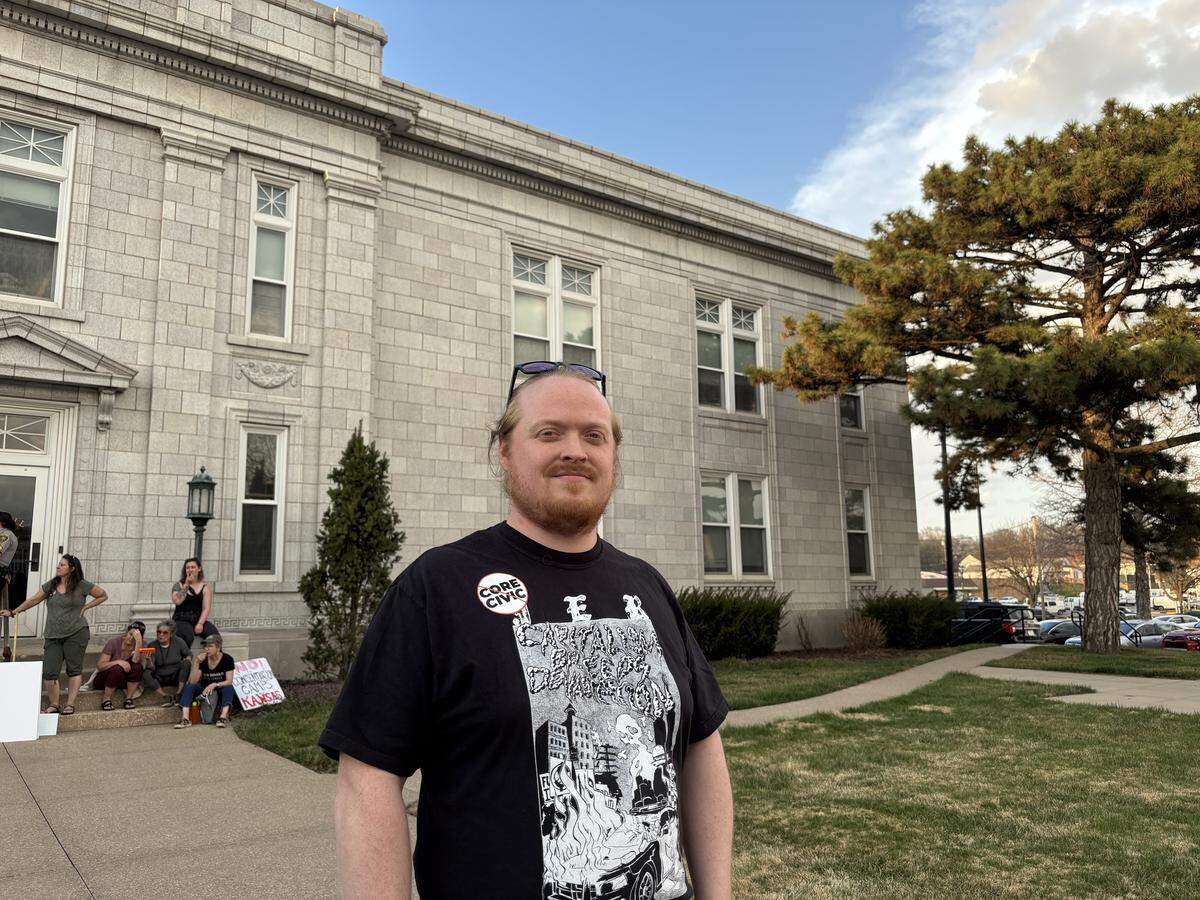 Ben Pickman, a Leavenworth resident, poses in front of the Leavenworth, Kansas city hall. Pickman spoke in front of city commissioners, urging them vote against private prison company CoreCivic to reopen their Leavenworth facility as an immigration detention center. March 10, 2026.