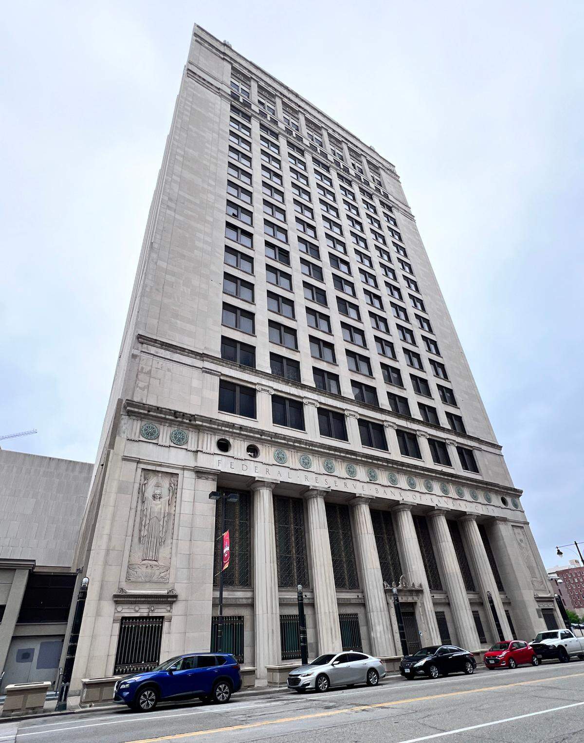 The former Federal Reserve building at 925 Grand stands vacant in downtown Kansas City, its once-stately exterior showing signs of decay after more than a decade of abandonment and a failed redevelopment effort.