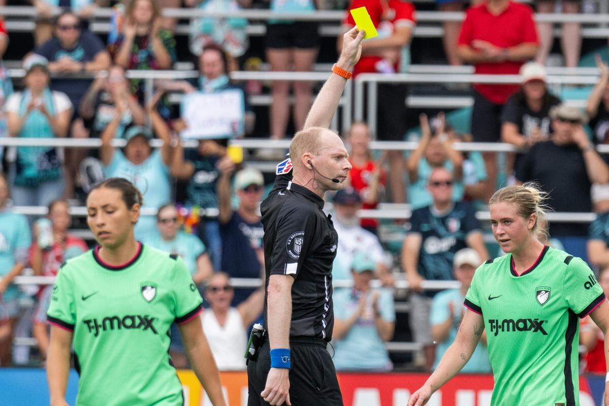 A referee hands a yellow card to a Boston Legacy FC player during the KC Current’s 1-0 victory on Saturday, May 30, 2026 at CPKC Stadium in Kansas City.