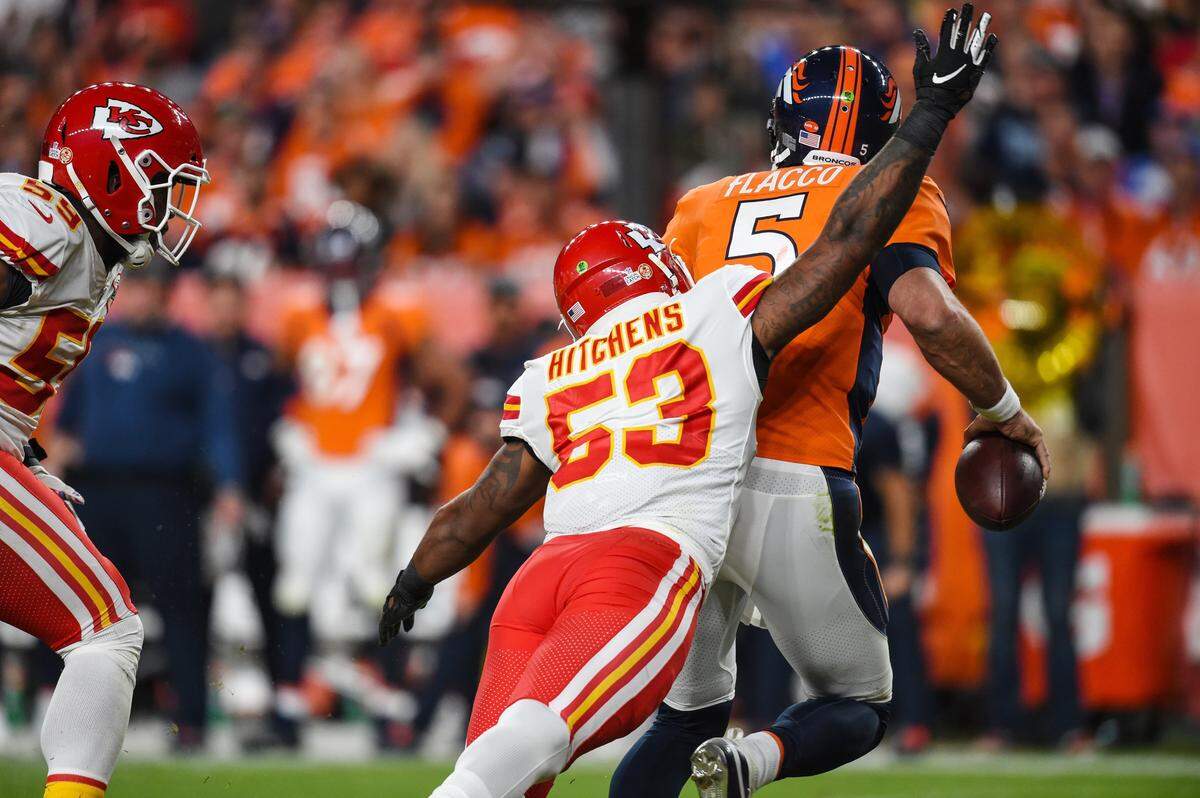 Denver Broncos quarterback Joe Flacco is sacked by Kansas City Chiefs inside linebacker Anthony Hitchens which forced a fumble recovered and run in for a touchdown by Kansas City Chiefs inside linebacker Reggie Ragland, 59, in the second quarter Thursday, October 17, 2019, at Empower Field at Mile High in Denver, Colorado.