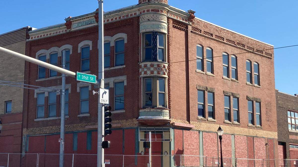 Fencing surrounds the Jeserich Building, an 1888 commercial building at 31st and Main street, that may soon face demolition.
