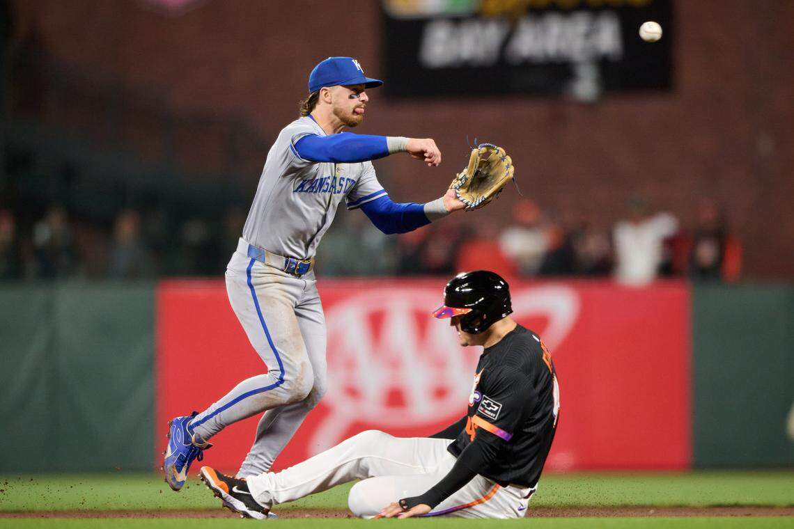 Kansas City Royals shortstop Bobby Witt Jr. (7) turns a double play against San Francisco Giants first baseman Wilmer Flores (41) during the seventh inning at Oracle Park on May 20, 2025.