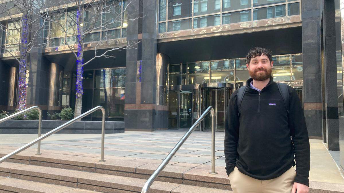 Joe Finkel, 24, heads into his downtown office at One Kansas City Place. Despite the ability to work at home, Finkel said he comes into the office at least three times a week.