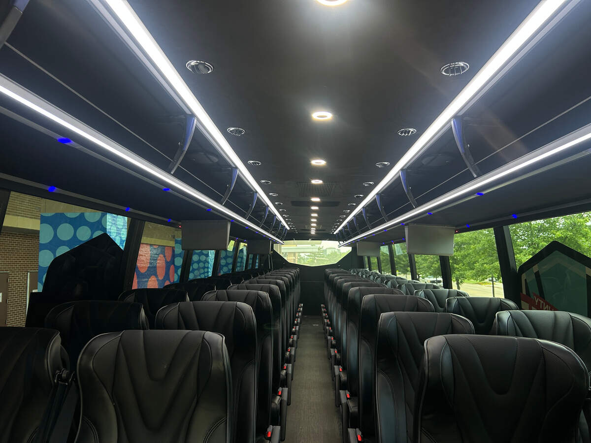 A Johnson County United shuttle stops at Overland Park Convention Center, one two pick-up and dop-off points in the new shuttle route, on June 8, 2026. The two 35 and 50-passenger charter buses run as ealy as 4:05 a.m. on weekdays and as late as 11:50 p.m. on weeknights.
