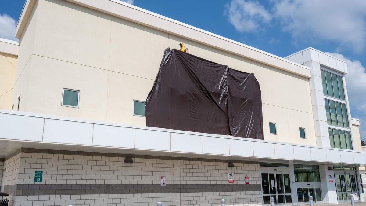 Sun Fresh Linwood with a black tarp covering its logo on Wednesday, Aug. 13, 2025, in Kansas City. The troubled grocery store closed the previous day.