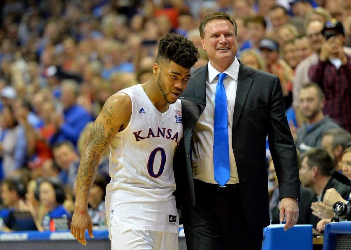 Kansas Jayhawks head coach Bill Self embraces guard Frank Mason III (0) after he leaves the court during the second half against the Oklahoma Sooners at Allen Fieldhouse on Feb. 27, 2017.