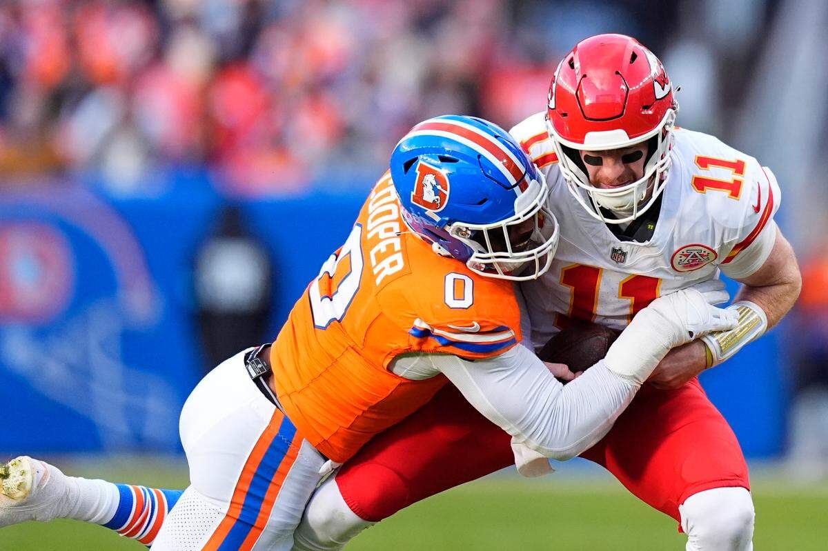 Broncos linebacker Jonathon Cooper sacks Kansas City Chiefs quarterback Carson Wentz during the teams’ NFL Week 18 game at Empower Field at Mile High in Denver on Sunday, Jan. 5, 2025.