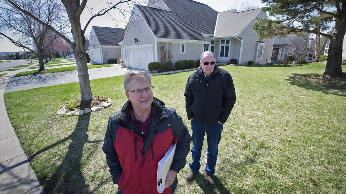 Lonnie Thompson (left) and Ron Fugate are among thousands of Johnson County residents who appealed their appraisals. Fugate was happy with the way his appeal turned out, Thompson less so. They live in similar town homes in the Stoneybrook subdivision in Overland Park.