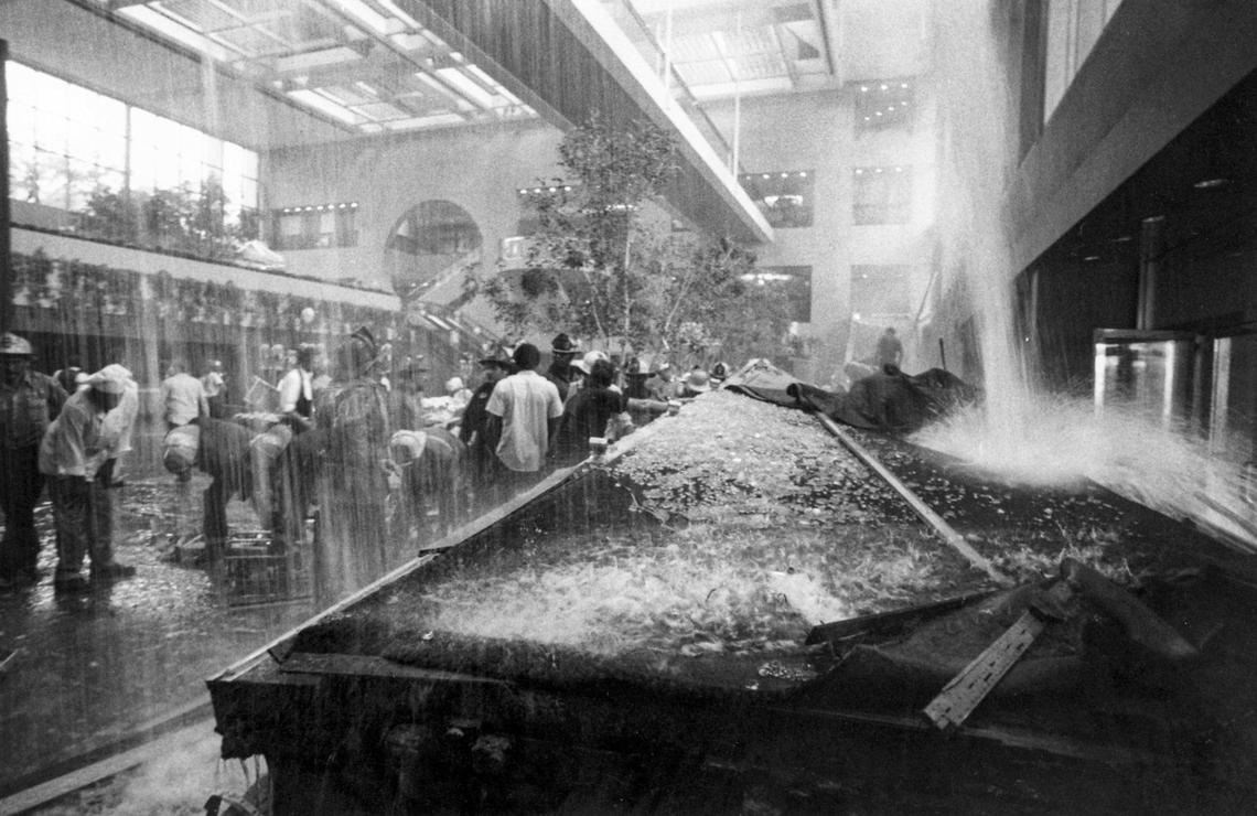 The chaotic scene inside the lobby of the Hyatt Regency Hotel on July, 17, 1981, moments after the skywalks crashed to the floor crushing and killing more than 100 people who were there for the Friday night tea dance. Water poured down from pipes that broke when the skywalks collapsed. Some of the people trapped under the rubble nearly drowned while rescuers raced to free them.