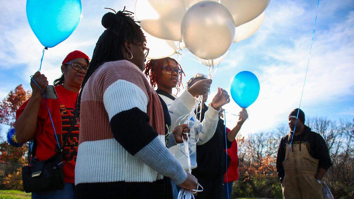 Family and friends of Kenneth “Kenny” R. Williams Jr., 32, held a balloon release to honor his memory on Nov. 23, 2023 outside a QuikTrip where he was shot and killed by a Raytown police officer. His family is demanding transparency from police as the highway patrol investigates the shooting.