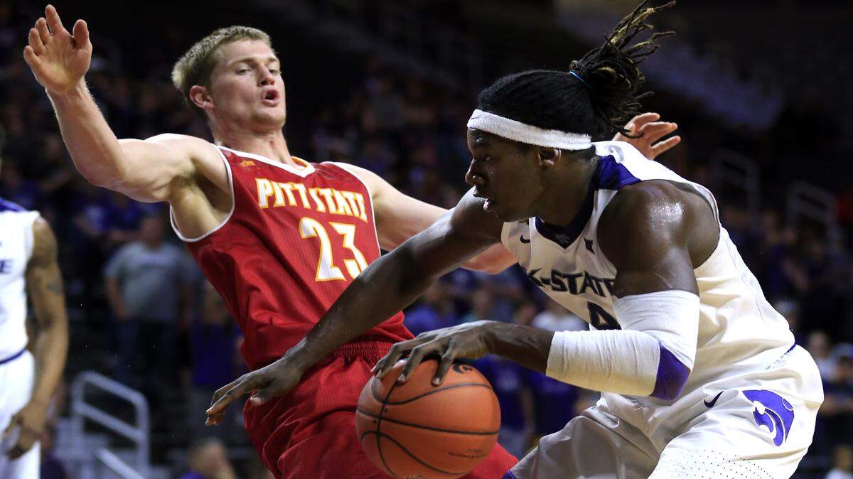 Kansas State forward D.J. Johnson, right, is fouled by Pittsburg State forward Creighton Brinker during the second half of an exhibition college basketball game in Manhattan, Kan., Friday, Oct. 28, 2016.