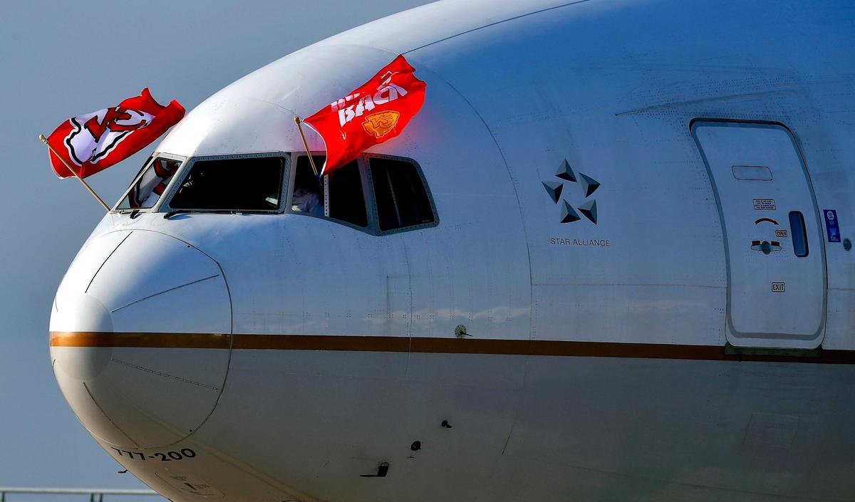 With the Chiefs flags waving in a stiff breeze, the team plane arrives Saturday evening in Tampa, where they will take on the Buccaneers Sunday in Super Bowl LV.