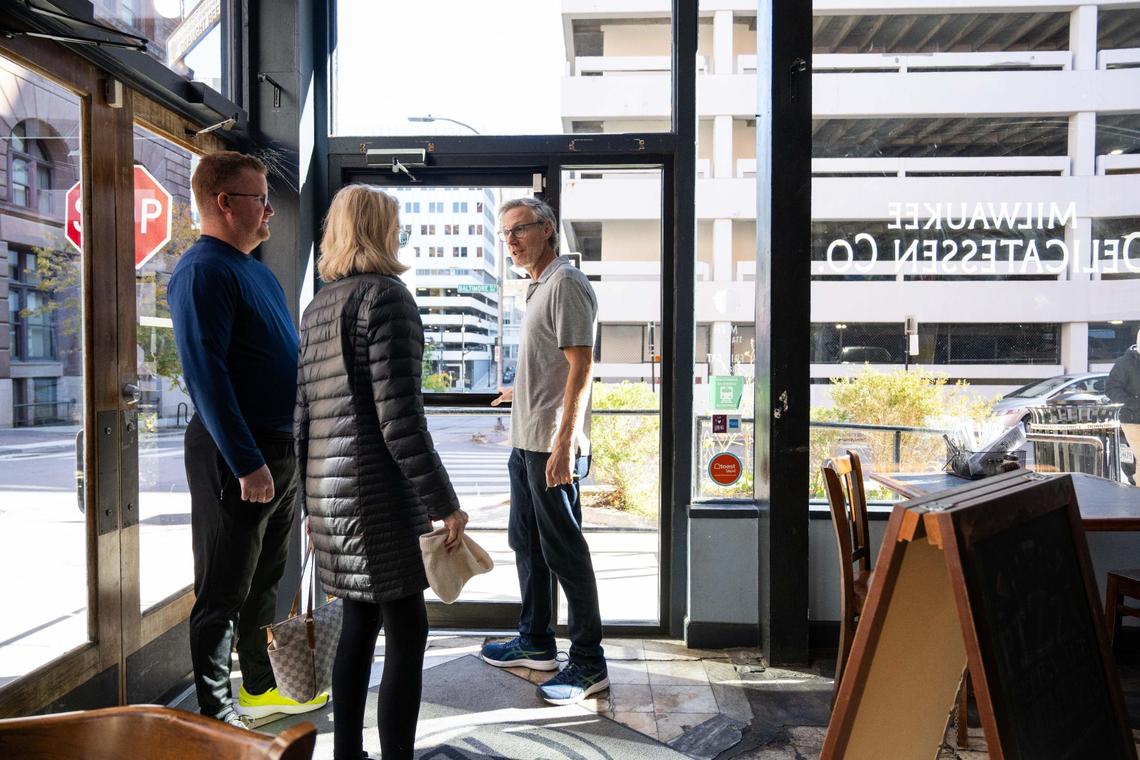 “I’ve had my life threatened,” Jon Gerner, owner of Milwaukee Delicatessen in downtown Kansas City, has said since the Catholic Diocese of Kansas City-St. Joseph relocated its breakfast program to 9th Street and Baltimore Avenue. on Tuesday. Gerner (right) explains to customers how the door to his business was broken during a break-in attempt.