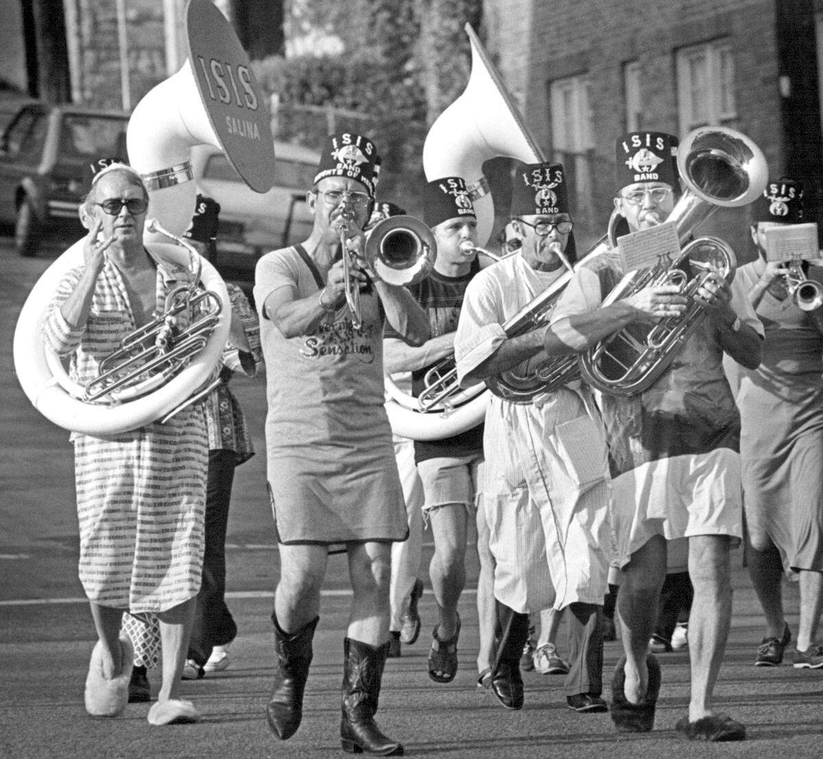 The Isis Shrine band from Salina, Kan., marches in impeccable formation through the Country Club Plaza during the Pajama Parade in 1980. The musicians, dressed in nightshirts, were attending a Shriners’ convention in Kansas City.