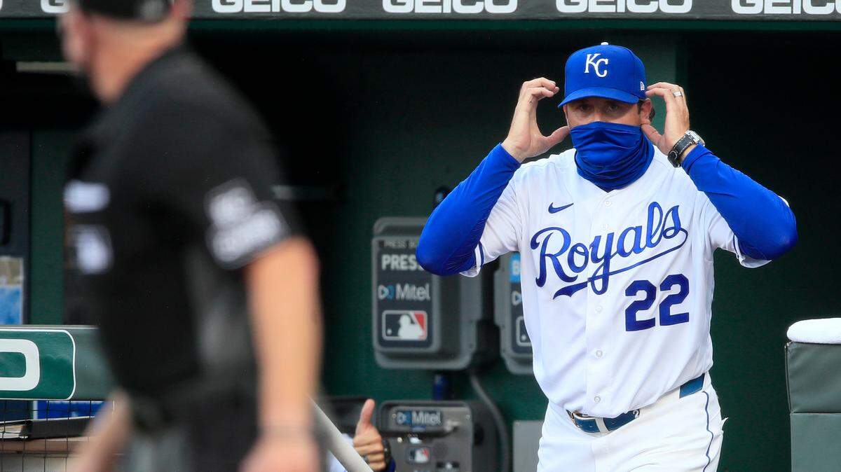 Kansas City Royals manager Mike Matheny calls for a play review during the third inning of a baseball game against the Chicago Cubs at Kauffman Stadium in Kansas City, Mo., Thursday, Aug. 6, 2020. (AP Photo/Orlin Wagner)