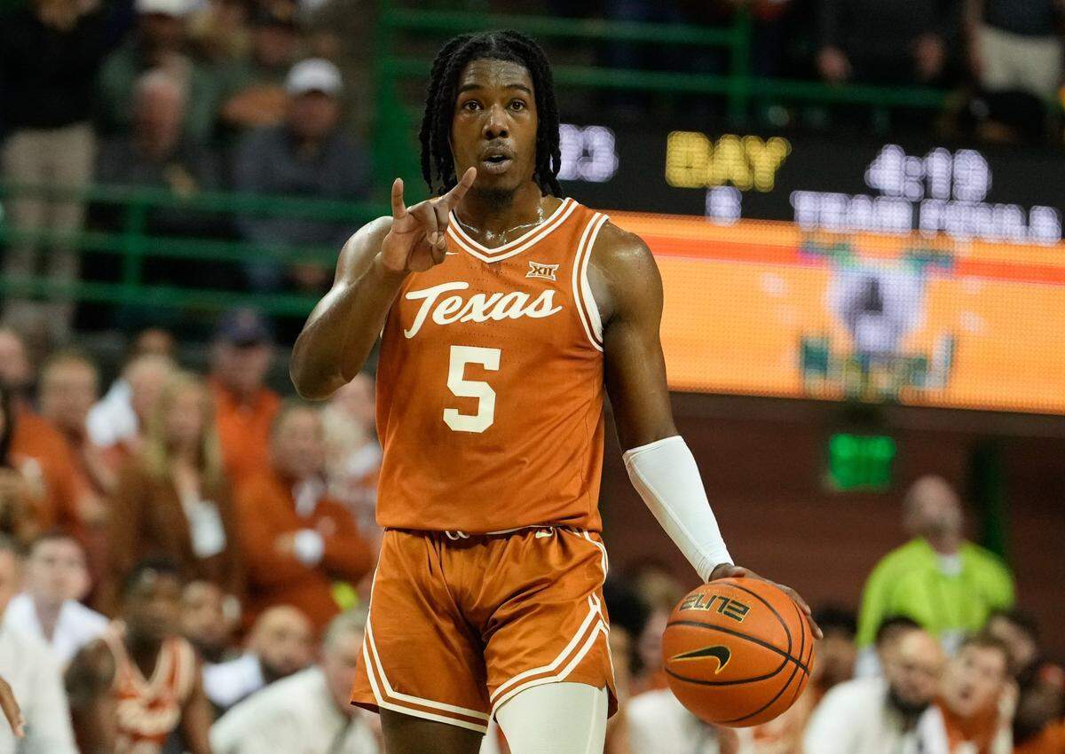 Texas Longhorns guard Marcus Carr (5) calls a play against the Baylor Bears during the first half at Ferrell Center on Feb. 25, 2023.