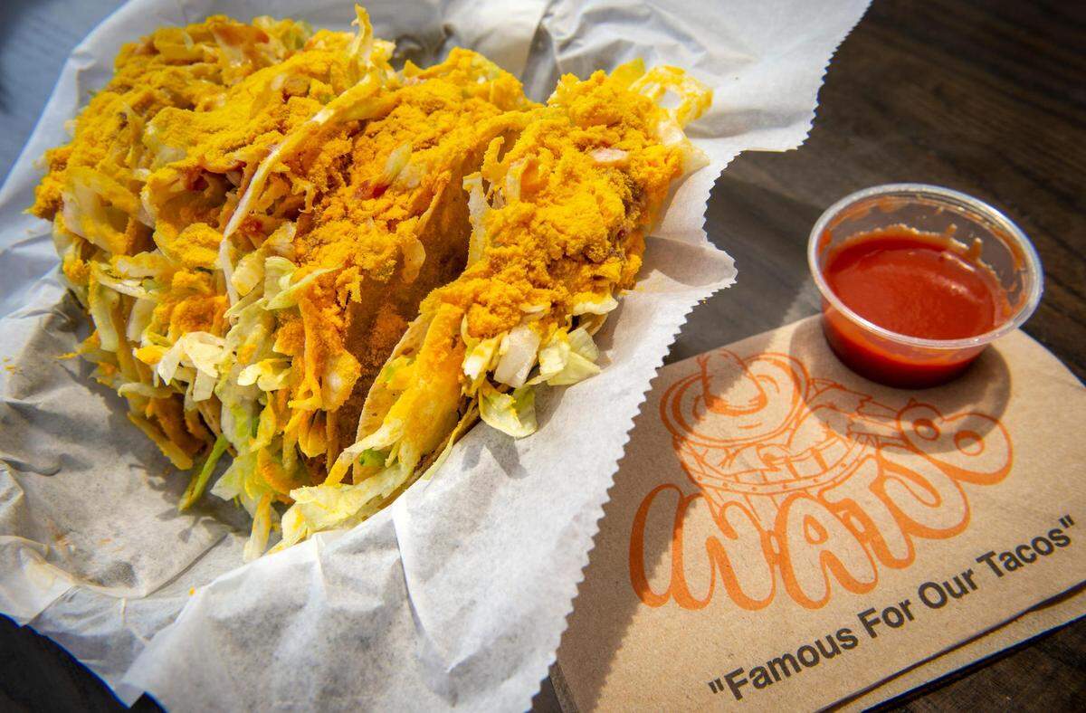 In-A-Tub, 4000 North Oak Trafficway, is famous for its deep-fried tacos topped with a powdered cheese.