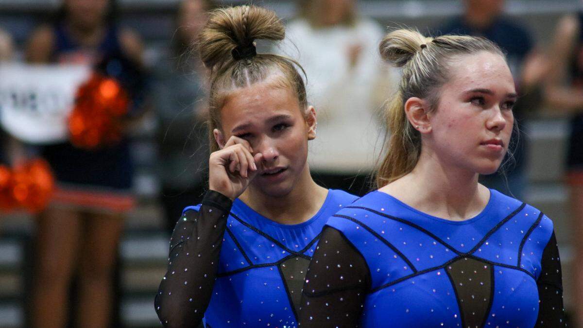 Sophia Beaumont, a senior from Olathe Northwest, wipes away a tear at the opening ceremonies of the KSHSAA Girls State Gymnastics Championship on Saturday, Oct. 25, 2025 in Olathe.