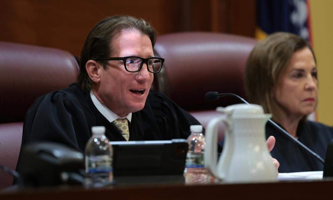Missouri Supreme Court Judge W. Brent Powell asks questions of attorneys, seated beside Chief Justice Mary R. Russell on Tuesday, Sept. 10, 2024 in Jefferson City as the court hears a case questioning whether an amendment to overturn the states abortion ban will remain on the states November ballot.