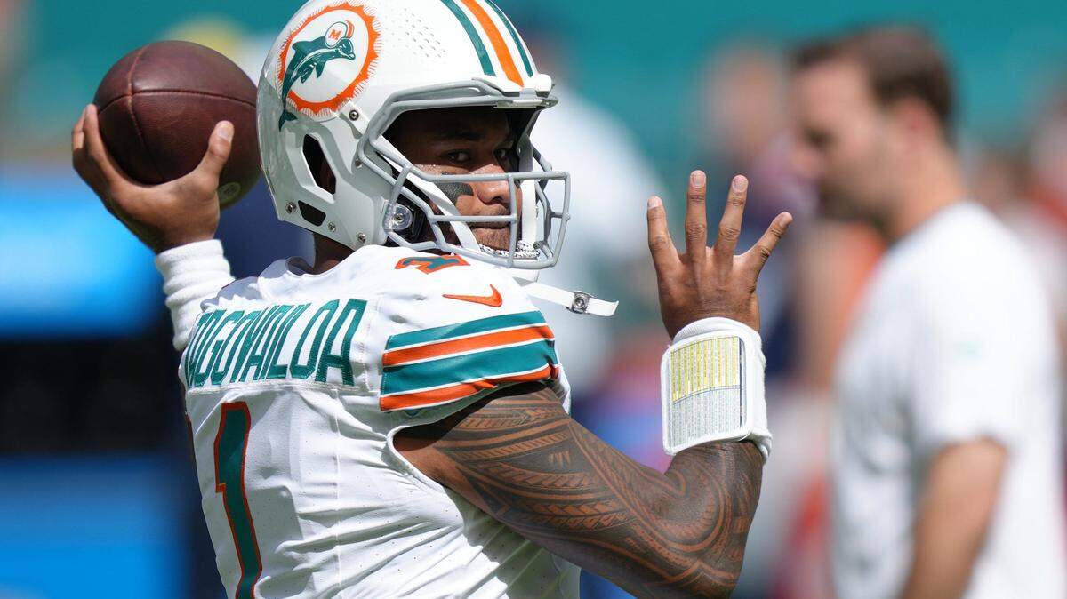 Miami Dolphins quarterback Tua Tagovailoa (1) warms-up before an NFL game against the New England Patriots at Hard Rock Stadium in Miami Gardens, Oct. 29, 2023.
