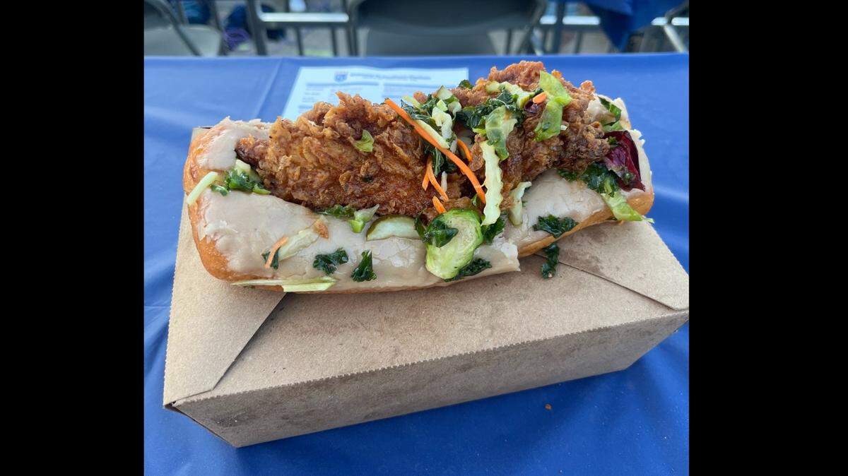 The Grand Slamwich, a long john donut with a maple glaze topped with a chicken tender tossed in gochujang sauce and pickles. It’s one of the new foods the Royals unveiled for the MLB playoffs.