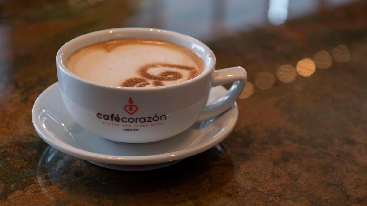 A cinnamon Café Corazón logo is featured on a Dulce De Leche latte in the Crossroads Arts District on Feb. 10, 2022.
