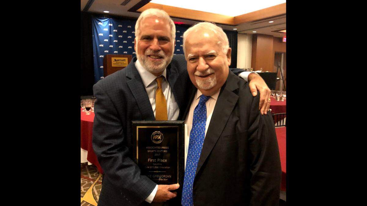 Vahe Gregorian and his father, Vartan, celebrate in Nashville several years ago on a night Vahe was regonized with a Top 10 sports columnist award from the Associated Press Sports Editors organization.