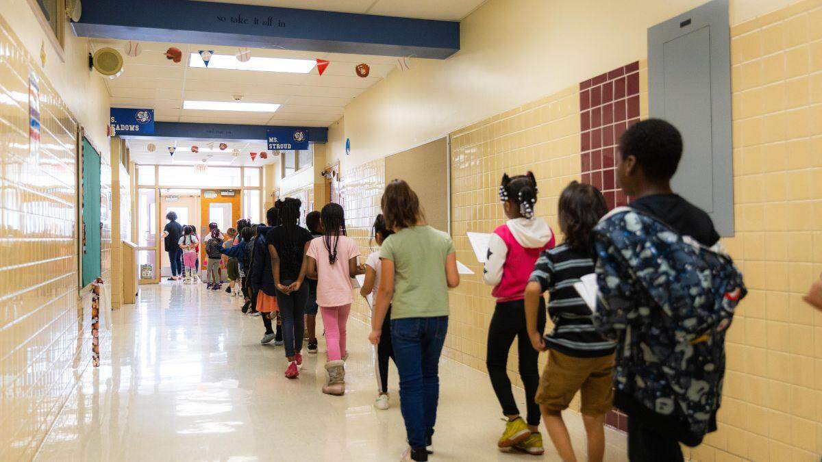 A large first grade class heads outdoors on at George Melcher Elementary School in Kansas City, Missouri. The school grew rapidly during the 2023-24 school year.