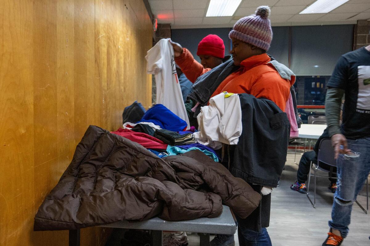 Dalyia Jones sorts through clothes at the Gregg Klice Community Center in Kansas City on Giving Tuesday.
