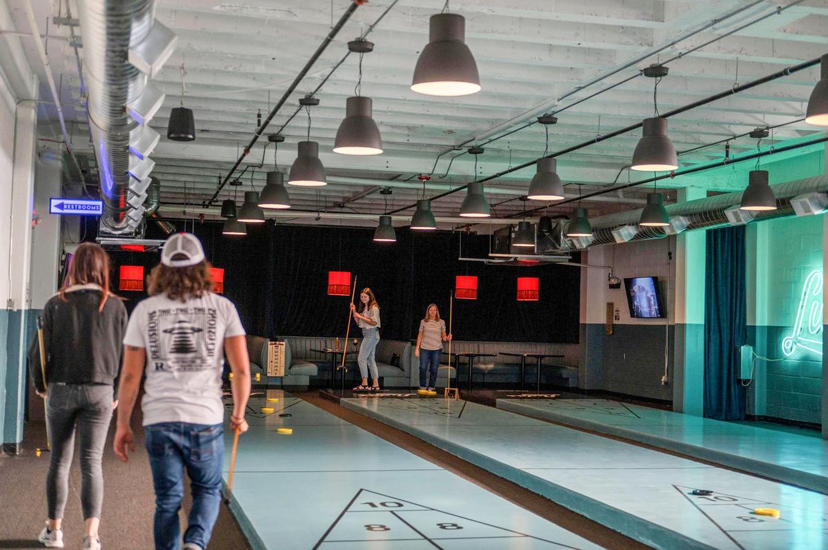 Three shuffleboard lanes are available at Ludo’s.