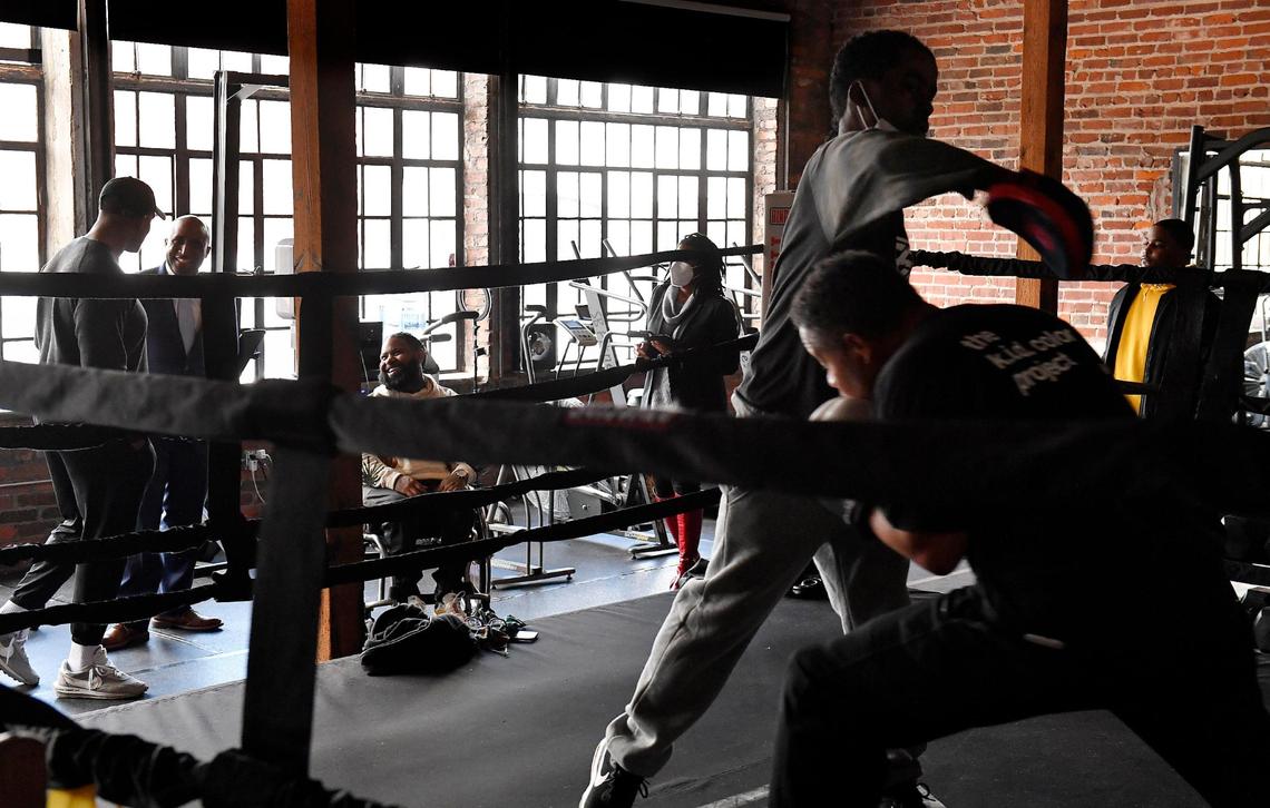 To honor Black History Month, Kansas City mayor Quinton Lucas, left rear, went on a tour Friday, recognizing some of Kansas City’s black businesses that specialize in health and wellness. At each stop, Lucas presented them with a proclamation of gratitude for their service. In the east Crossroads district, Lucas stopped to chat with Jabari Washington, far left, and Wesley Hamilton. Hamilton operates Disabled But Not Really and Washington owns The TUF Club. Both businesses operate out of the same space where they work with clients to strengthen their mental and physical performance.