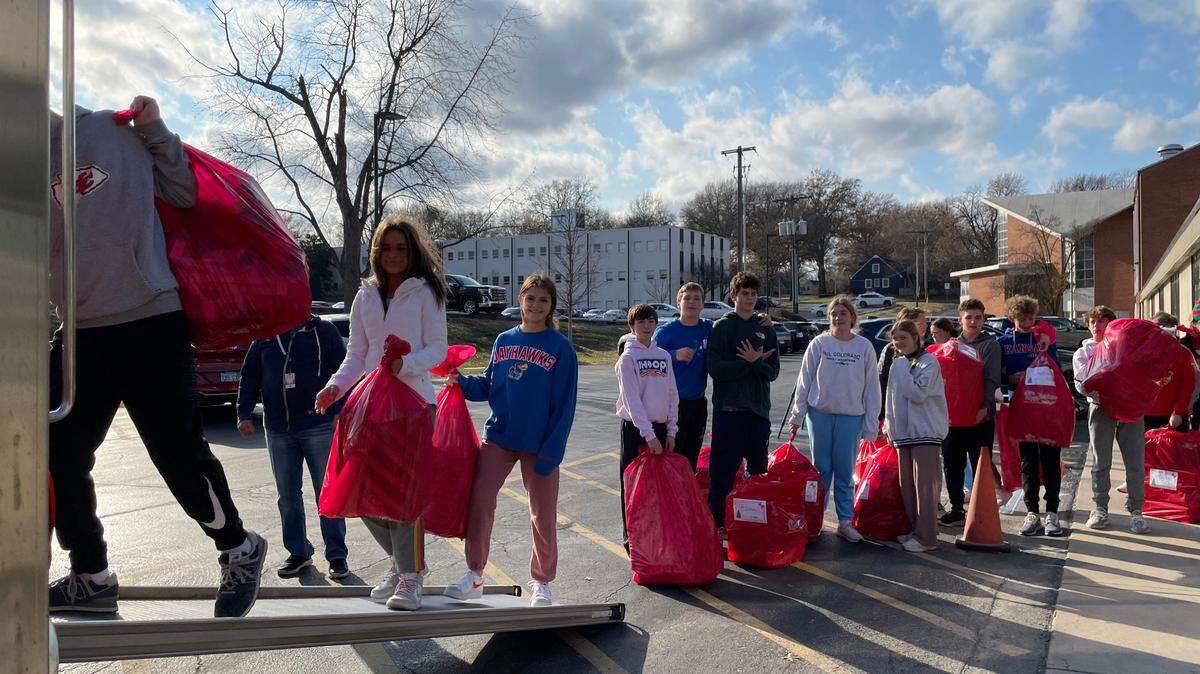 St. Ann School eighth-graders in Prairie Village helped load more than 225 bags of donated gifts for Red Bag KC, a nonprofit organization. Individuals, faith communities, businesses and organizations choose items from children’s wish lists. St. Ann families donated gifts for 154 children. Red Bag KC helps more than 1,700 local children.