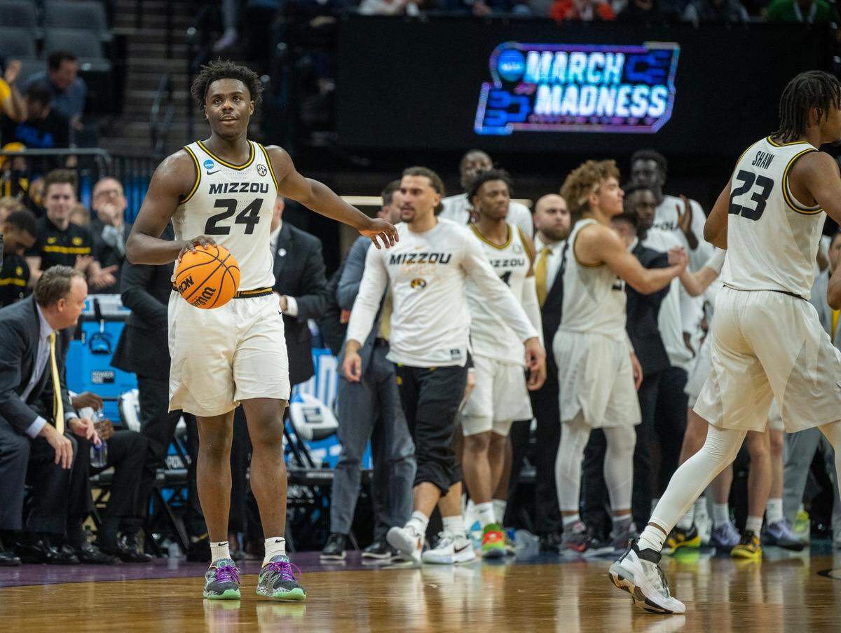 Missouri Tigers guard Kobe Brown (24) holds the ball during the final second of the game against the Utah State Aggies at the NCAA Tournament at Golden 1 Center in Sacramento, Thursday, March 16, 2023. Missouri Tigers won 76-65.