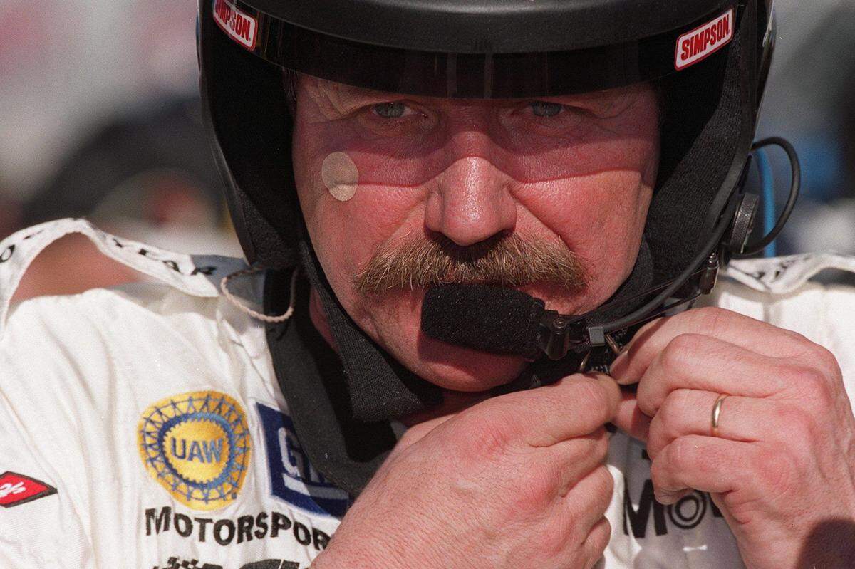 Dale Earnhardt Sr. adjusts his helmet during testing at Daytona International Speedway on Jan. 5, 2001.