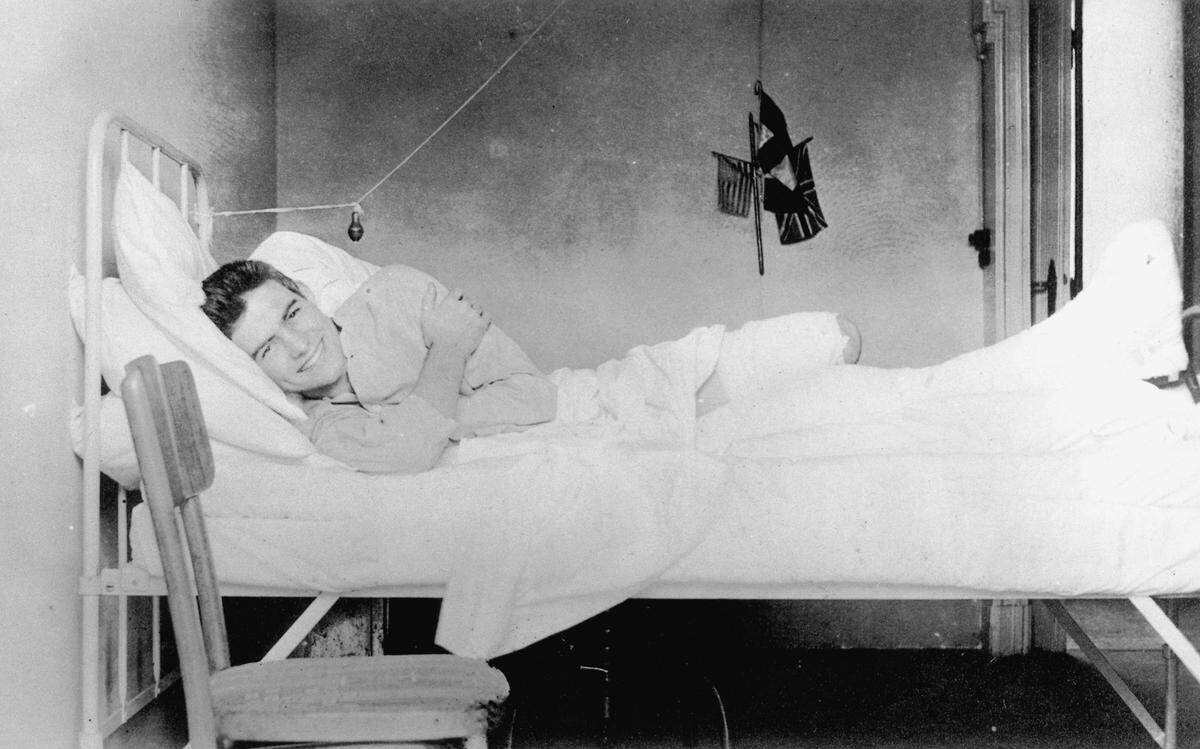 Ernest Hemingway recovering from wounds at the American Red Cross hospital near Milan, Italy, in July 1918.