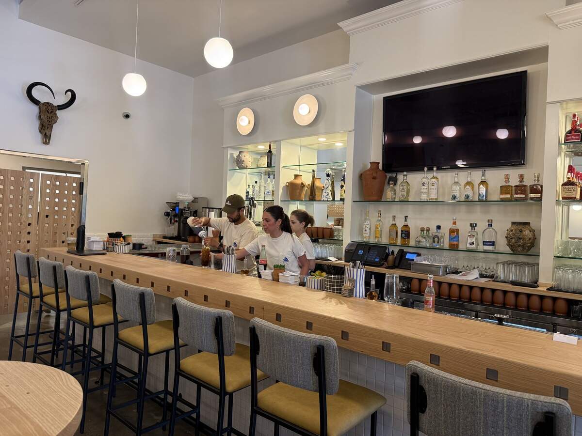 Bartenders pour drinks at Casa Ama, a new Mexican-style restaurant in Prairie Village.