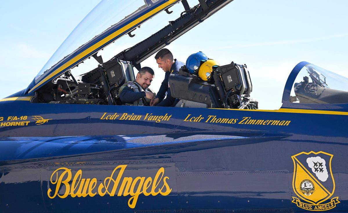 Erik Erazo, left, was preped for his flight by AD2 Cameron Tuzon with the U.S. Navy Blue Angels.