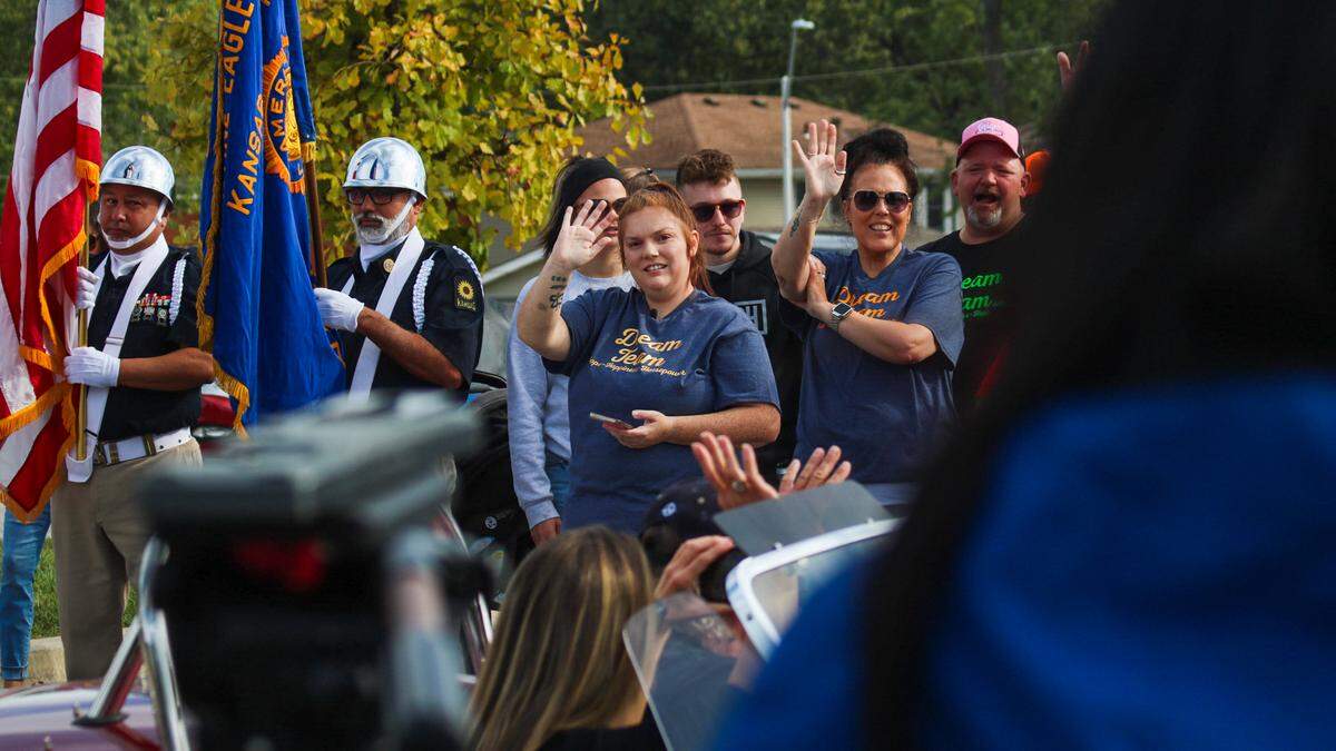Chandler Langford and her family wave at participants of a parade on Oct. 11, 2025, that was organized to honor her 3-year-old son Tucker.