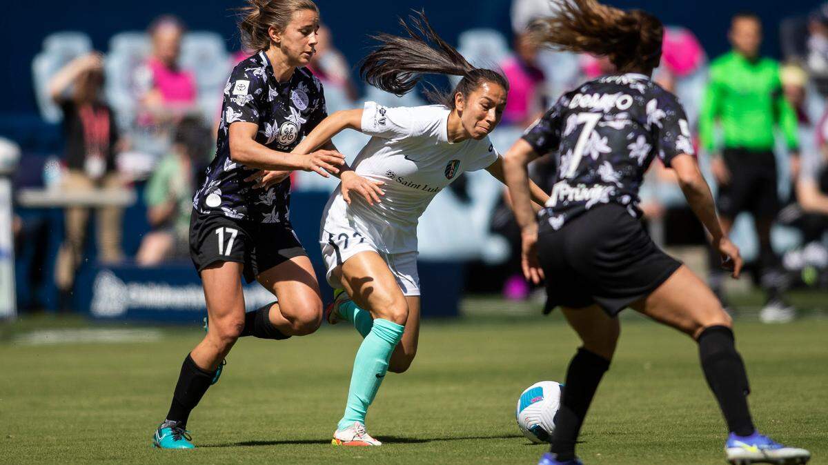 KC Current defender Alex Loera (22) fights through the defense during the home opener between the KC Current and Racing Louisville on April 2, 2022 at Children’s Mercy Park in Kansas City, KS