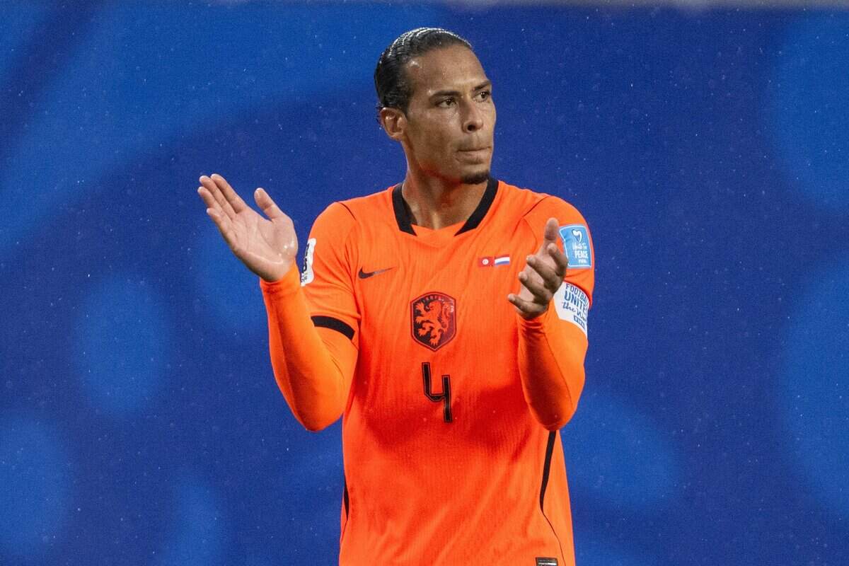 Netherlands defender Virgil van Dijk (4) claps in the rain in a FIFA World Cup group-stage soccer match at Kansas City (Arrowhead) Stadium in Kansas City on Thursday, June 25, 2026.