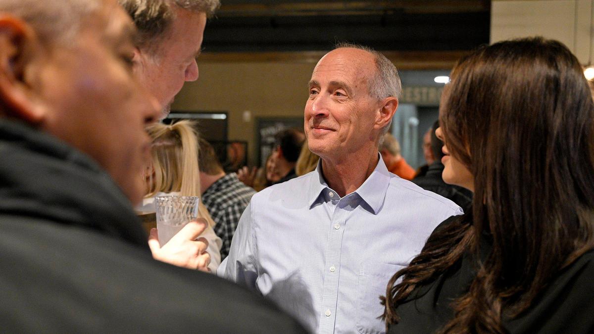 Overland Park mayoral candidate Mike Czinege talks with supporters at his watch party at Another Broken Egg Cafe on Tuesday. Czinege, a retired AMC Theatres executive, faced longtime City Councilman Curt Skoog in the race.